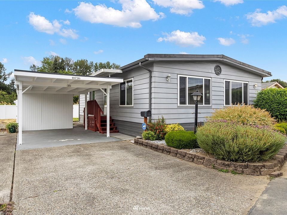 Double wide with private carport and shed>