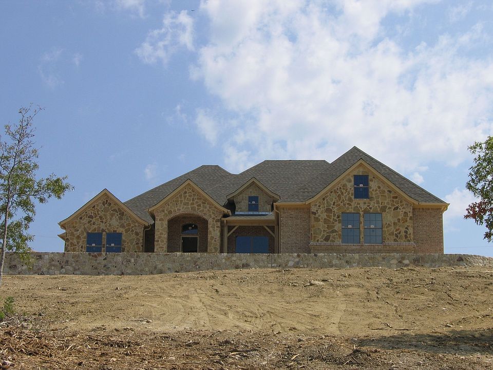 This home sits high on a hill with spectacular views and beautiful sunsets.