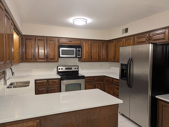 A kitchen made for cooking, family, and friends with plenty of counter space and lots of storage!