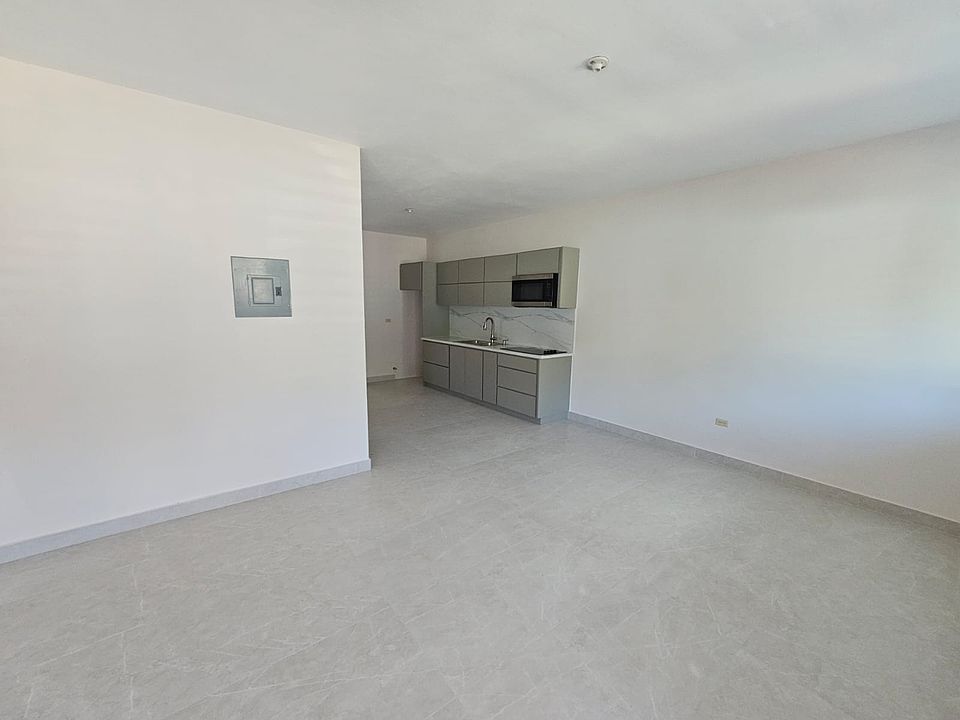Living room and dinner room area. Spacious and ventilated.