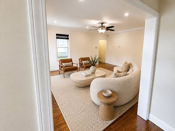 Living room with front door entry landing. Fireplace.