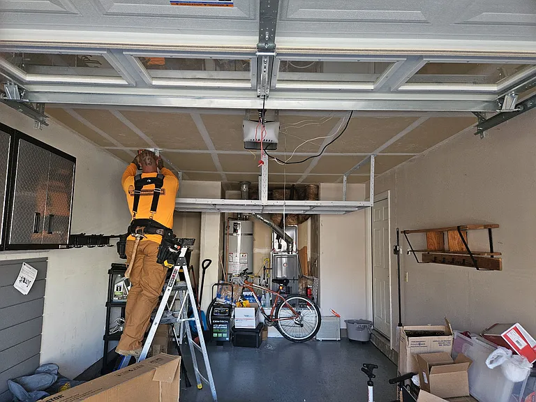Large Ceiling Storage Unit and Coat Rack on the Right Wall