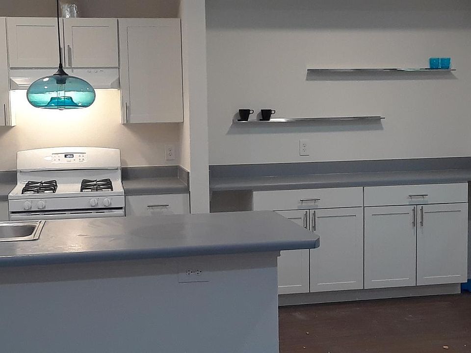Extended kitchen and stainless steel shelves ...