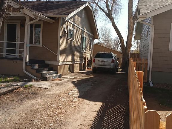 Front of the house with two open space parking.