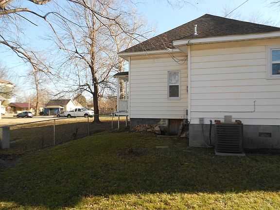 Back of house... There is a door to the cellar that gives you some comfort on those stormy nights. Also a large backyard!