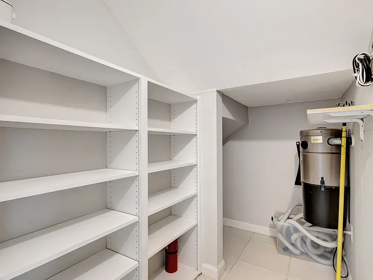 Closet under stairs w/ central vac