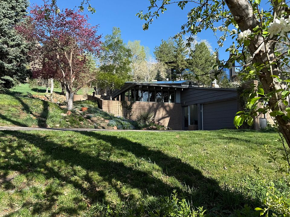 Exterior of house from bridge over the Farmer''s Ditch on the property.