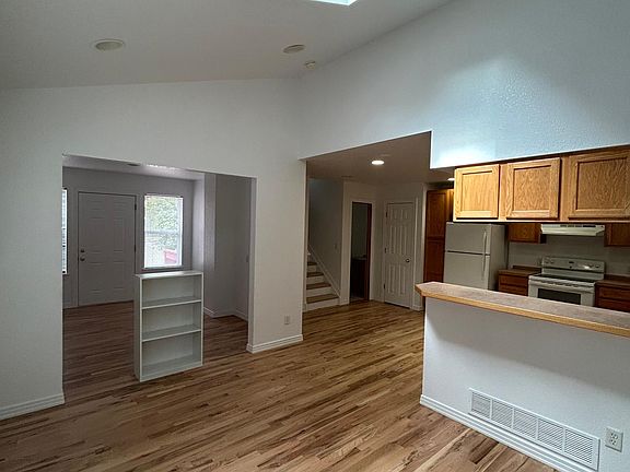 living room, dining and kitchen beyond. Home office/study with separate entrance to left.