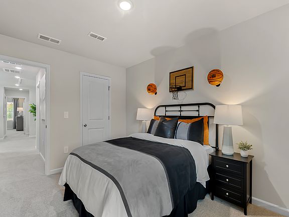 Two secondary bedrooms are ideally situated away from the primary suite.