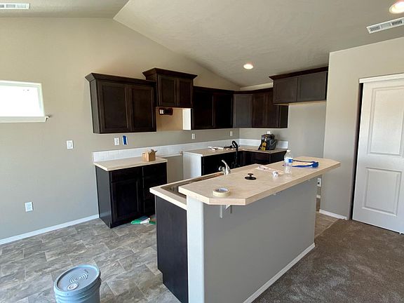 Kitchen, excuse the construction mess, home is not completed yet. Stainless Steel Appliances, Vaulted, Breakfast Bar, Pantry.