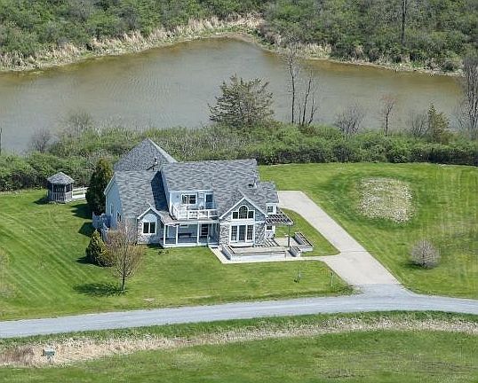 Aerial of home with conservation area behind