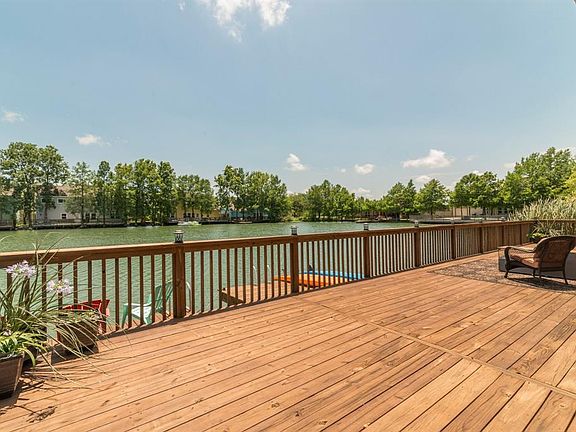 View from the deck looking across part of the lake. This lake is stocked with fish and can be swam.