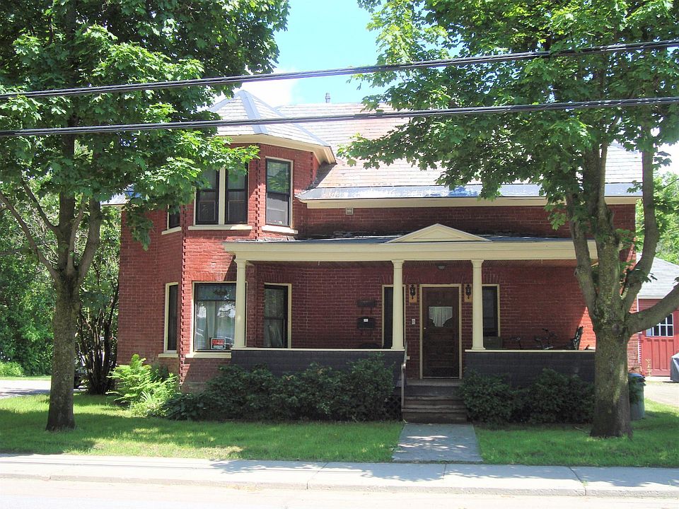 The front porch is shared by both units. The entrance to upstairs is from this porch.