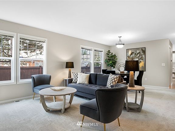 Main floor living room and dining room, perfect for all of your friends to come together.