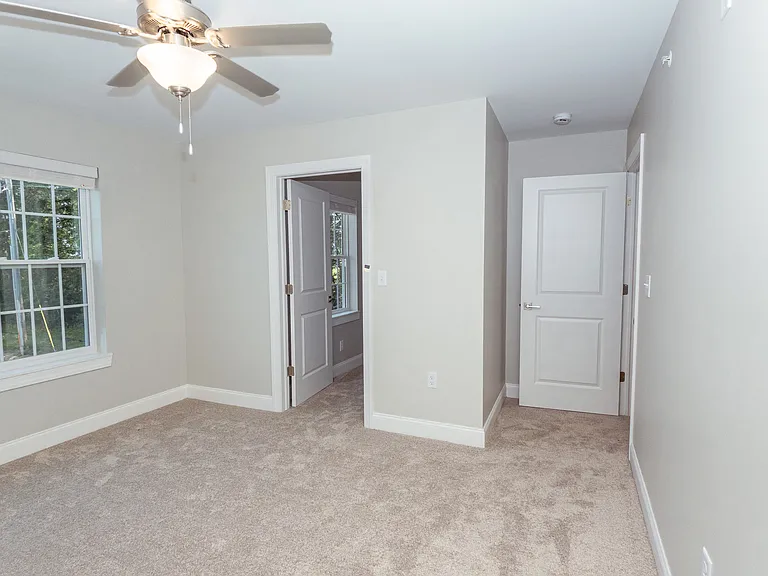 Main bedroom with entrance to walk-in closet
