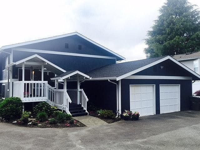 Front of house. Shared 2 car garage. Driveway has 2 shared parking spots. Lots of street parking in front of property