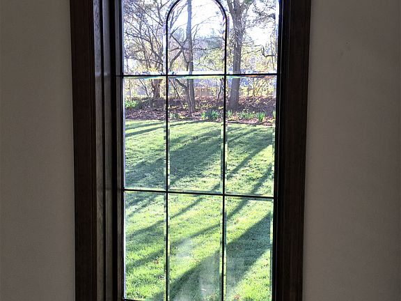 Beveled windows by fireplace