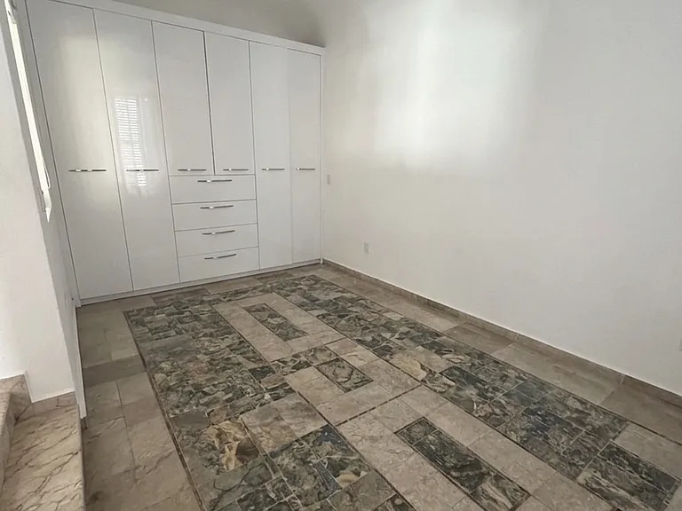 Bedroom with built in closet/drawers