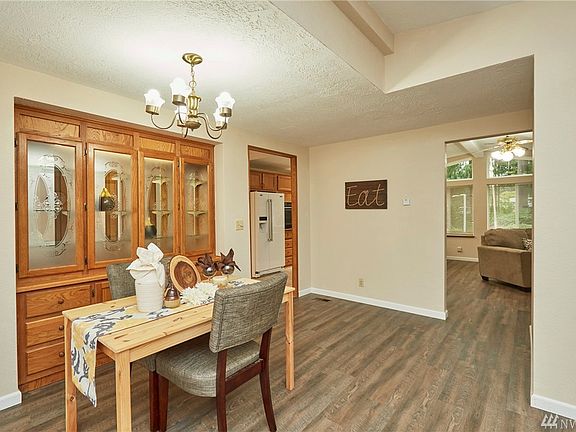 Great Open Space Dining Room Looking into Kitchen (Upper Right) and Family Room(Right). New Laminate Flooring!