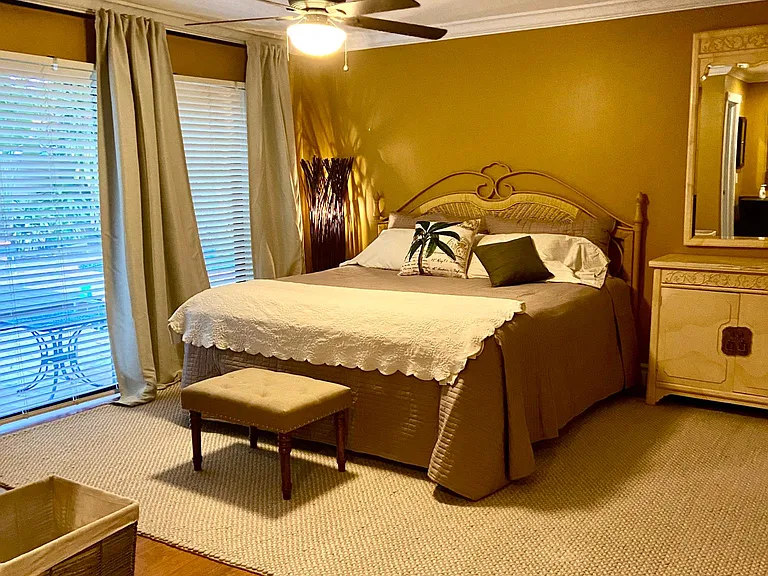 third bedroom master bedroom large 8 foot sliding glass door leading to pool and deck and outdoor shower