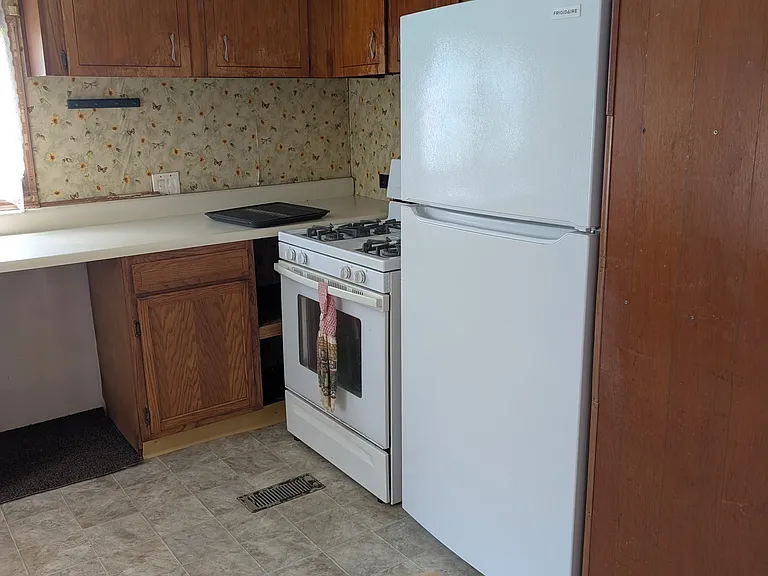 New fridge, gas stove, new floor coverings throughout.