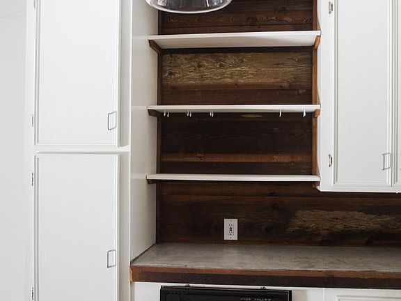Open cabinet area.