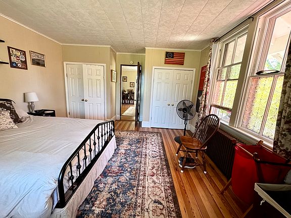 spacious bedroom with his and hers closets.