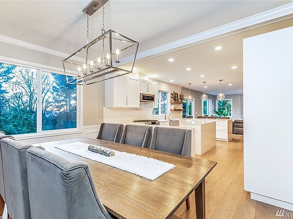 A wall between the dining room and kitchen was removed to open up living space and let light fill the rooms. Note the size of the dining space - lots of space for your large dining table