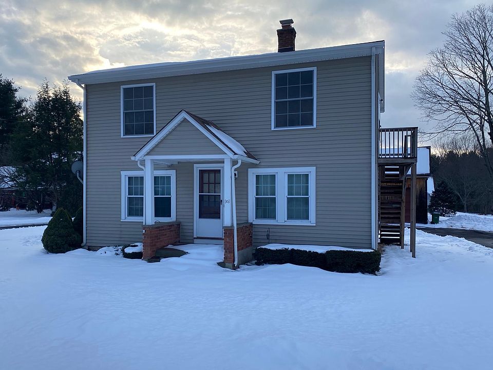 Front of 2 family home. Unit is on second floor. This side is the emergency exit side. The other side stairs are covered