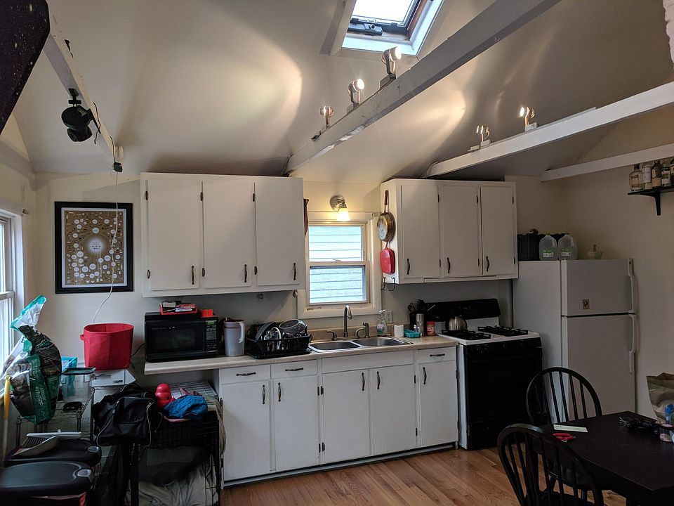 Kitchen/Dinning area with vaulted ceiling & skylight