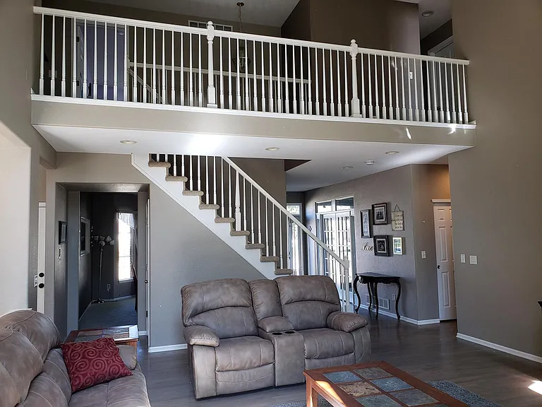 Entry hall, stairs, and living room.