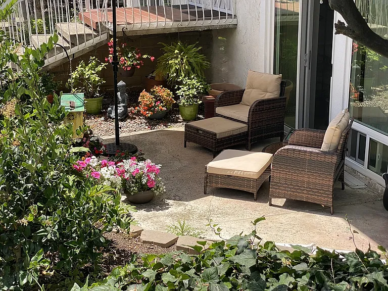 View of patio with chairs to read and relax and private entrance to your room.
