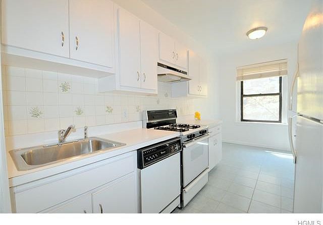Eat-in-Kitchen with French Style Butler Door to the Living / Dining Room.