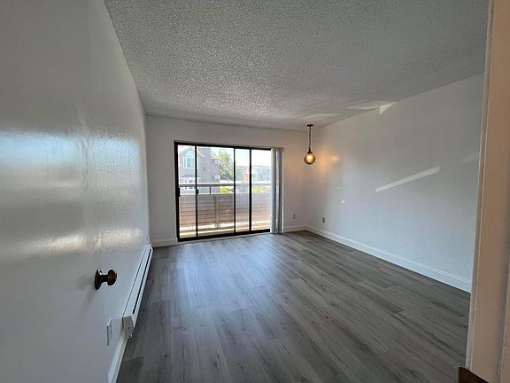 Master bedroom with patio door to the balcony