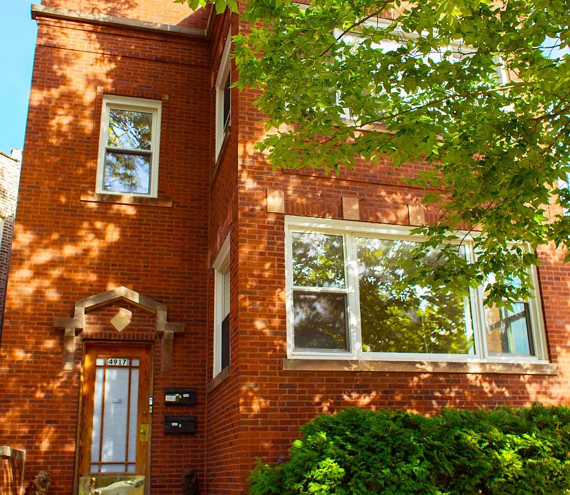 Beautiful brick 2 flat with lower level shared free laundry and large storage area