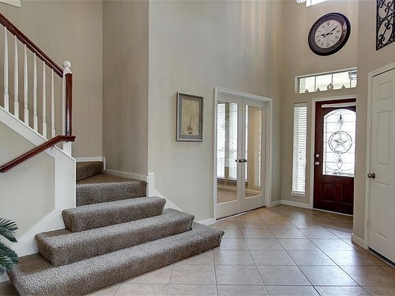 Double Glass Door Entry into Study off of Entry.