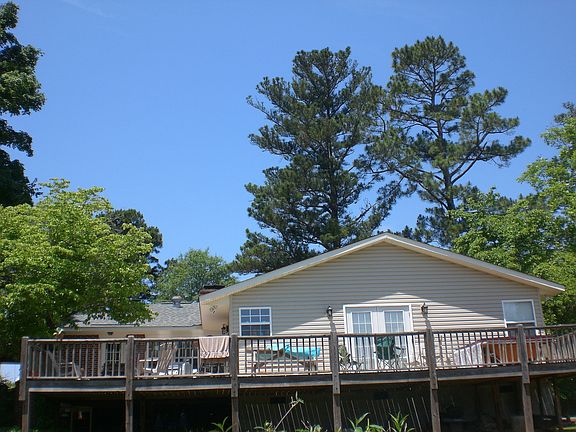 Back of house with deck