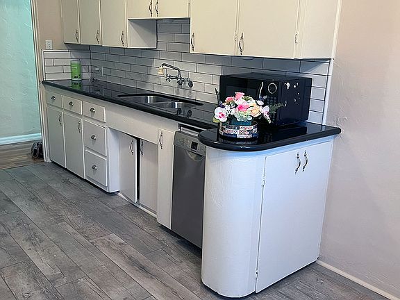"Modern" kitchen with 4 burner gas stove and oven, microwave, refrigerator and tons of cabinet and counter space