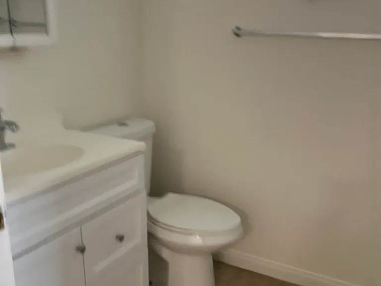 Hallway bathroom upstairs with tub and shower.
