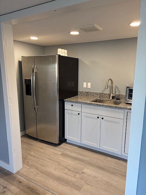 Kitchen! Full sized fridge with ice and water in the door, convection oven-air fryer combo, two burner counter top stove, lazy Susan corner cabinet for lots of storage!