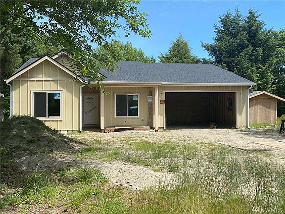 Photo of builder's previous build and not exact of home under construction.