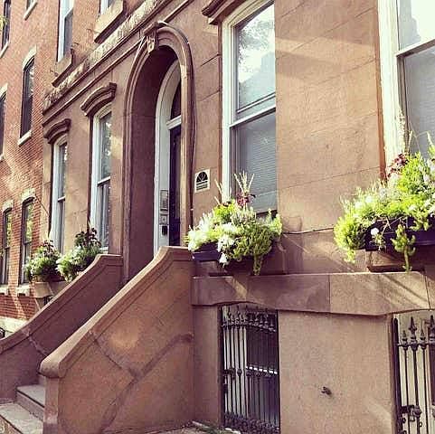 REstored BRSTONE Facade with PLanters
