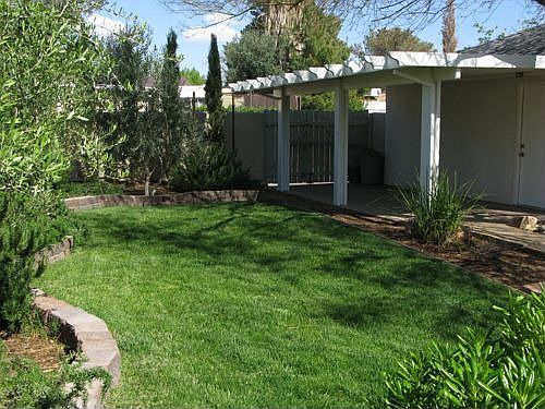 Serene back yard, carport and garage