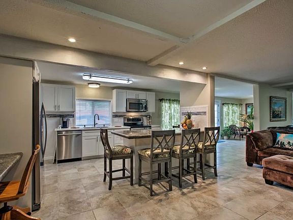 open kitchen and dining with granite countertops