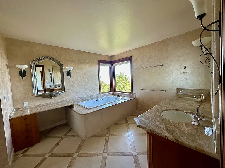 Large bathroom with double-sink, soaking tun, shower (not shown here) and water closet (not shown here).