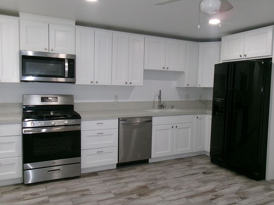 Kitchen with refrigerator