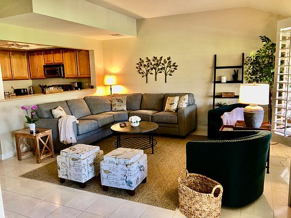 Roomy living room with fireplace and 58" tv, open to kitchen and patio