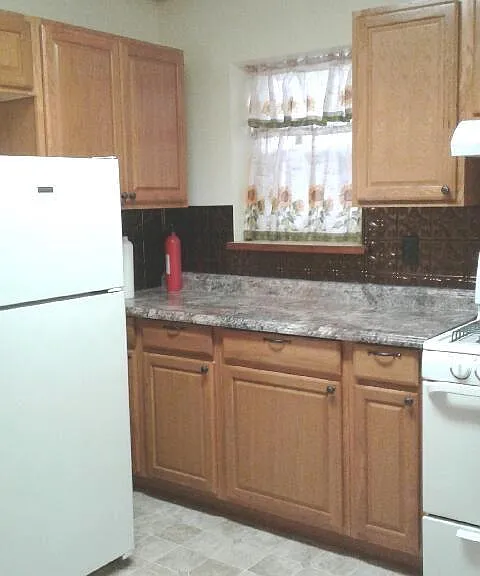 Kitchen, full size stove and refrigerator