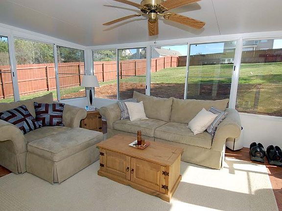 Enjoy the outdoors in comfort in your heated and cooled sunroom!