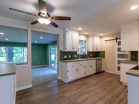 Kitchen looking out to large family room.
